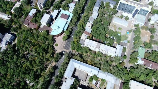 Sosnovyy Park and theater along busy Nauryzbai Batyr Street, Almaty Kazakhstan