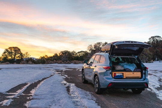 SUV Car Camper Parked On Road With Snow