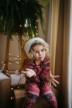 Girl with Christmas pajamas on Christmas day