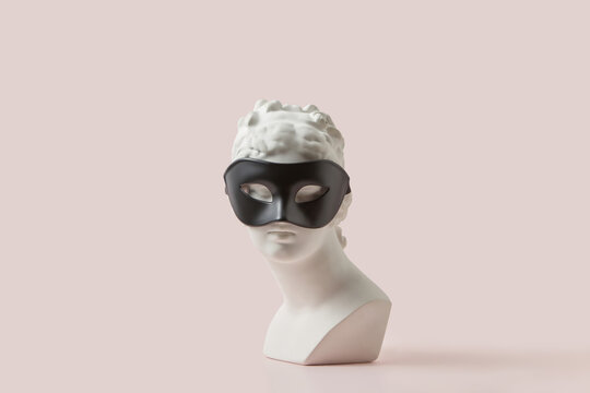 Plaster antique goddess statue in black mask.
