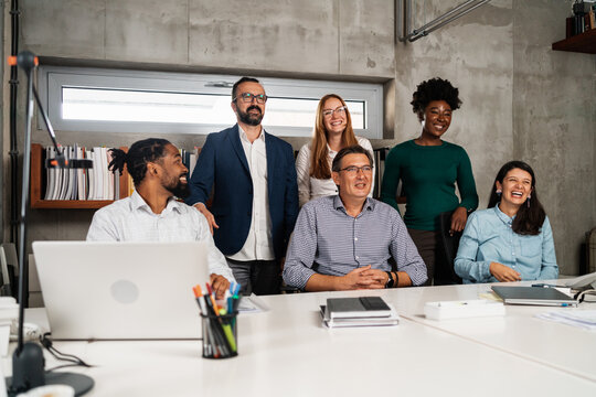 Spontaneous Group Portrait Of Diverse People In The Office