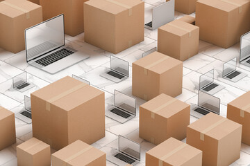 Laptop next to cardboard boxes