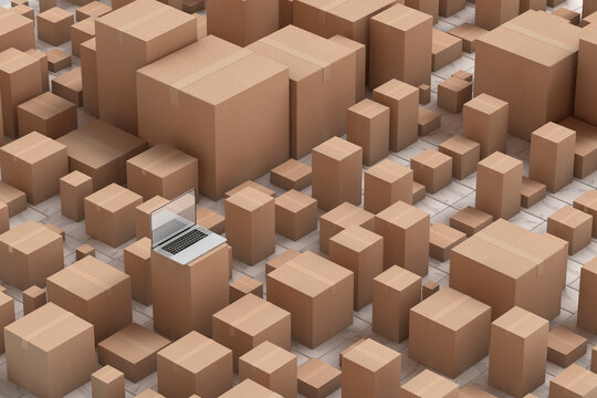 Laptop in the middle of some cardboard boxes