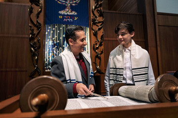 Synagogue: Rabbi Working With Male Teen On Torah Portion