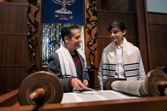Synagogue: Rabbi Working With Male Teen On Torah Portion