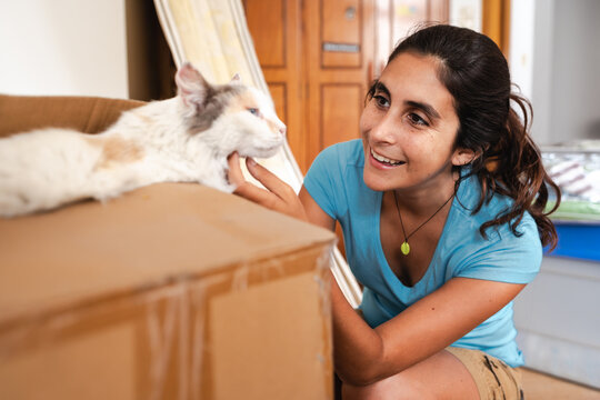 woman home moving with her cat