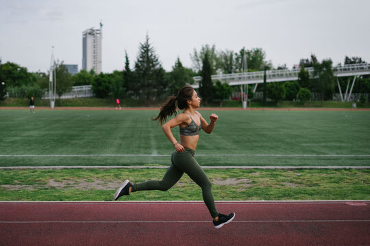Latina Woman Running Fast
