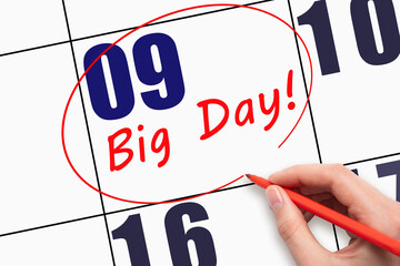9th day of the month. Hand writing text BIG DAY and circling the calendar date.