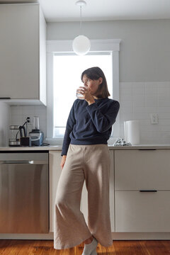 Happy Young Woman In Her New Kitchen