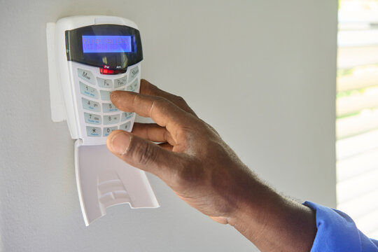 pressing button on security alarm