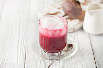 Vegetable drink. Healthy beetroot latte  on table. Copy space