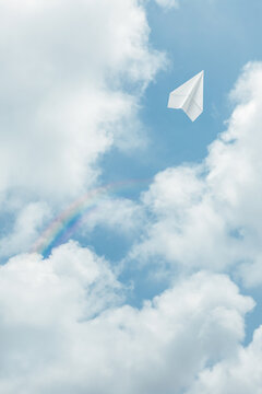  Paper airplane flying in the clear sky.