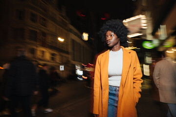 Stylish Woman Walking On The Street At Night
