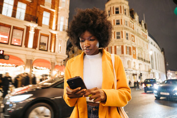 Woman Using Technologies On The Street