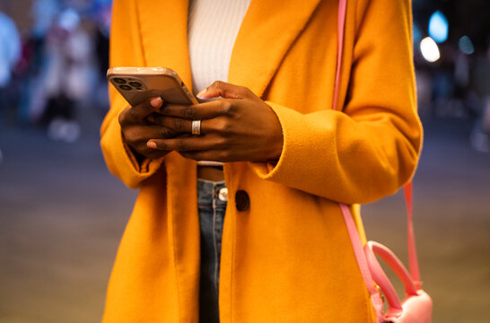 Woman Hands Holding Phone Outdoors At Night
