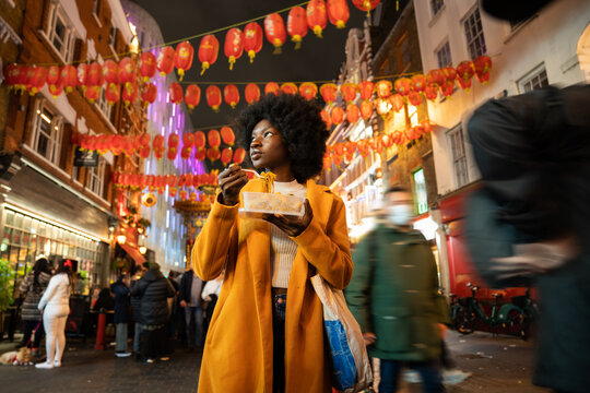 Woman Enjoying Food In London China Town