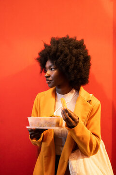 Candid Image Of Woman Eating Asian Food