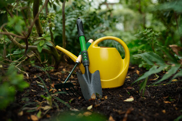 Watering can, shovel and rake garden tool closeup selective focus © Nomad_Soul