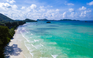 Drone view from above at a tropical beach in the Seychelles, Anse Volbert beach Praslin