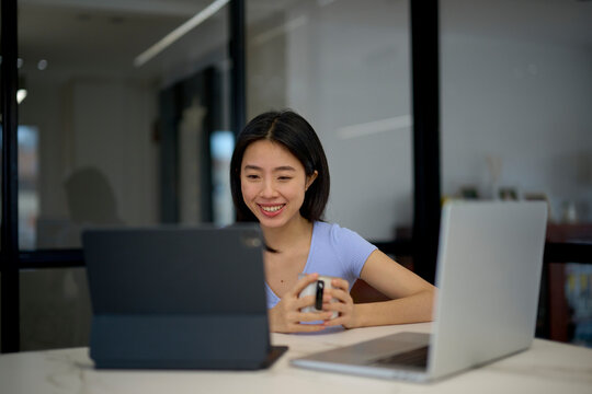 Businesswoman watching video during break