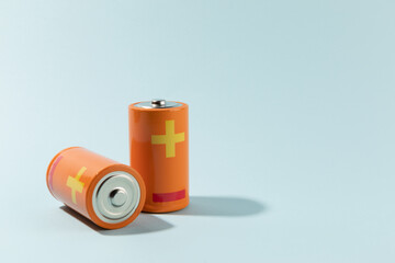 Batteries isolated on cyan, energy concept