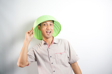 handsome asian man acting or posing silly with serving hood