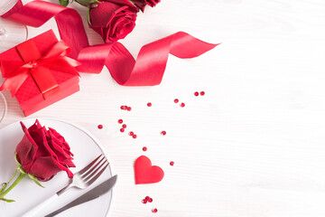 Valentines day table setting with red roses