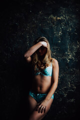 tanned girl in blue lingerie. beautiful figure
