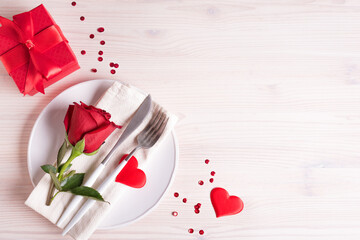 Valentine's day table setting with red rose