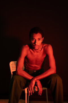 Young man with neon light