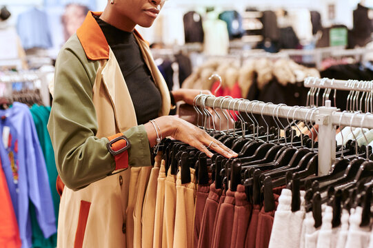 Woman browsing for pants in shop