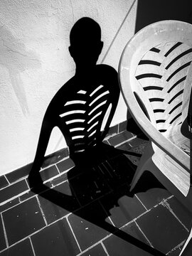Shadow of a man with the form of an alien.