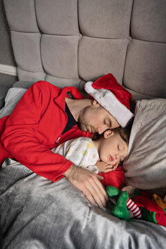 Father and son are sleeping at Christmas eve