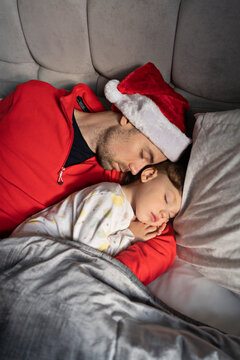Father and son are sleeping at Christmas eve