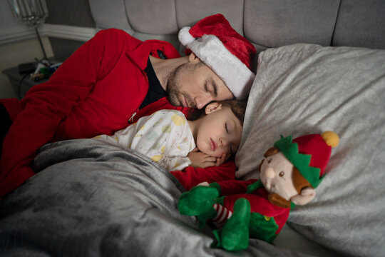 Father and son are sleeping at Christmas eve