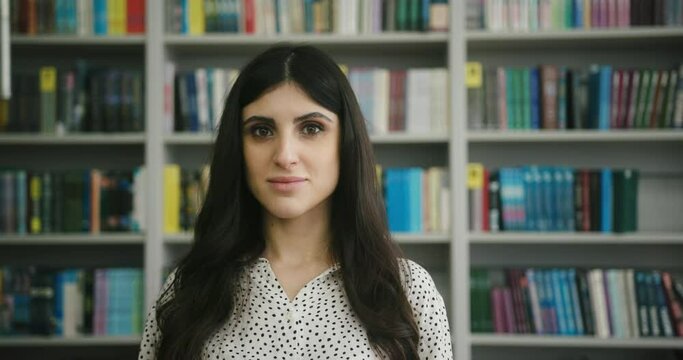 Young Arab woman tells about spending day in library