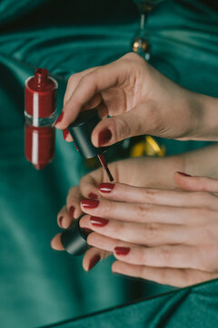 A woman doing her nail polish