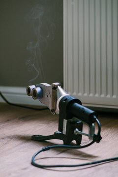 PVC Pipe welding machine near metal radiator