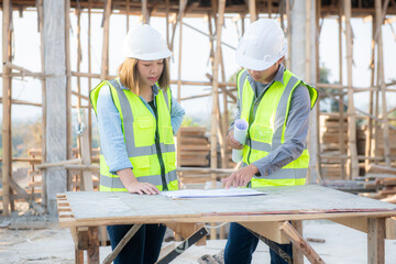 Fototapeta premium Smart civil architect engineer inspecting and working outdoors structure building site with blueprints. engineering and architecture concept.