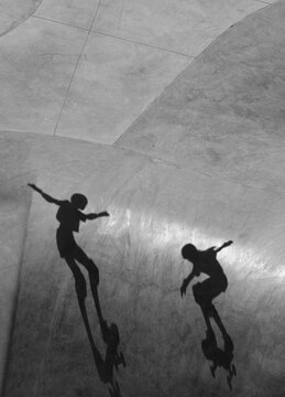 Shadows of a skateboarders 
