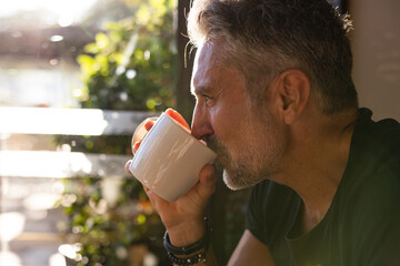 Mature man with cup of coffee