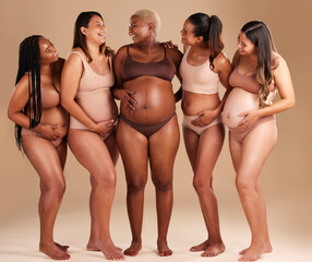 Women group, pregnant or body and stomach touch in baby support, diversity solidarity or excited on studio background. Smile, happy or pregnancy friends in underwear, funny joke or comic belly growth