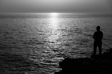 Fototapeta premium fishing at sunset