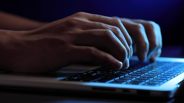 closeup of hands typing for making analysis report or coding at night