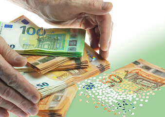 Hands grabbing stacks of euro bills. A 50 euro bill has turned into confetti.