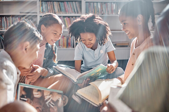 Education, Books Or Students Reading In A Library For Group Learning Development Or Growth. Storytelling, Kids Or Happy Children Talking Together For Knowledge On Funny Fantasy Stories At School