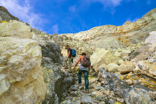 Two Men Hiking In Volcano Kawah Ijen, Java, Indonesia