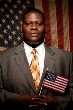 A man poses for a portrait as a first time voter in the November 2012 United States Presidential Election for a project on new amercian voters.