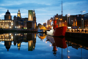 The red light ship at canning dock next to Albert dock with the Liver building in the background, Liverpool, England, UK