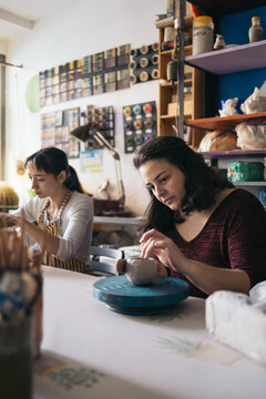 Women working in a pottery workshop